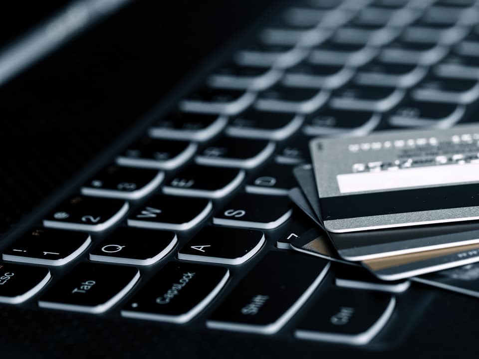credit cards on a laptop keyboard